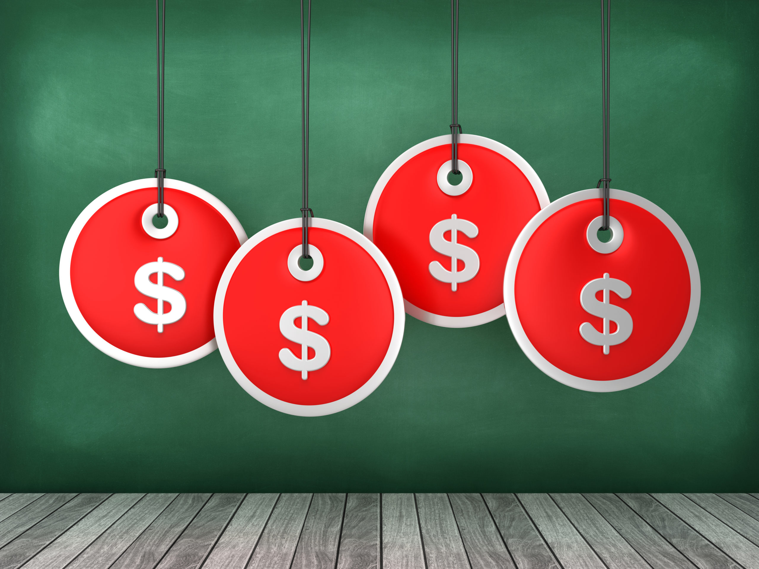 Dollar sign price tags hanging on chalkboard background - conceptual image representing online pricing survey methods for determining optimal product pricing