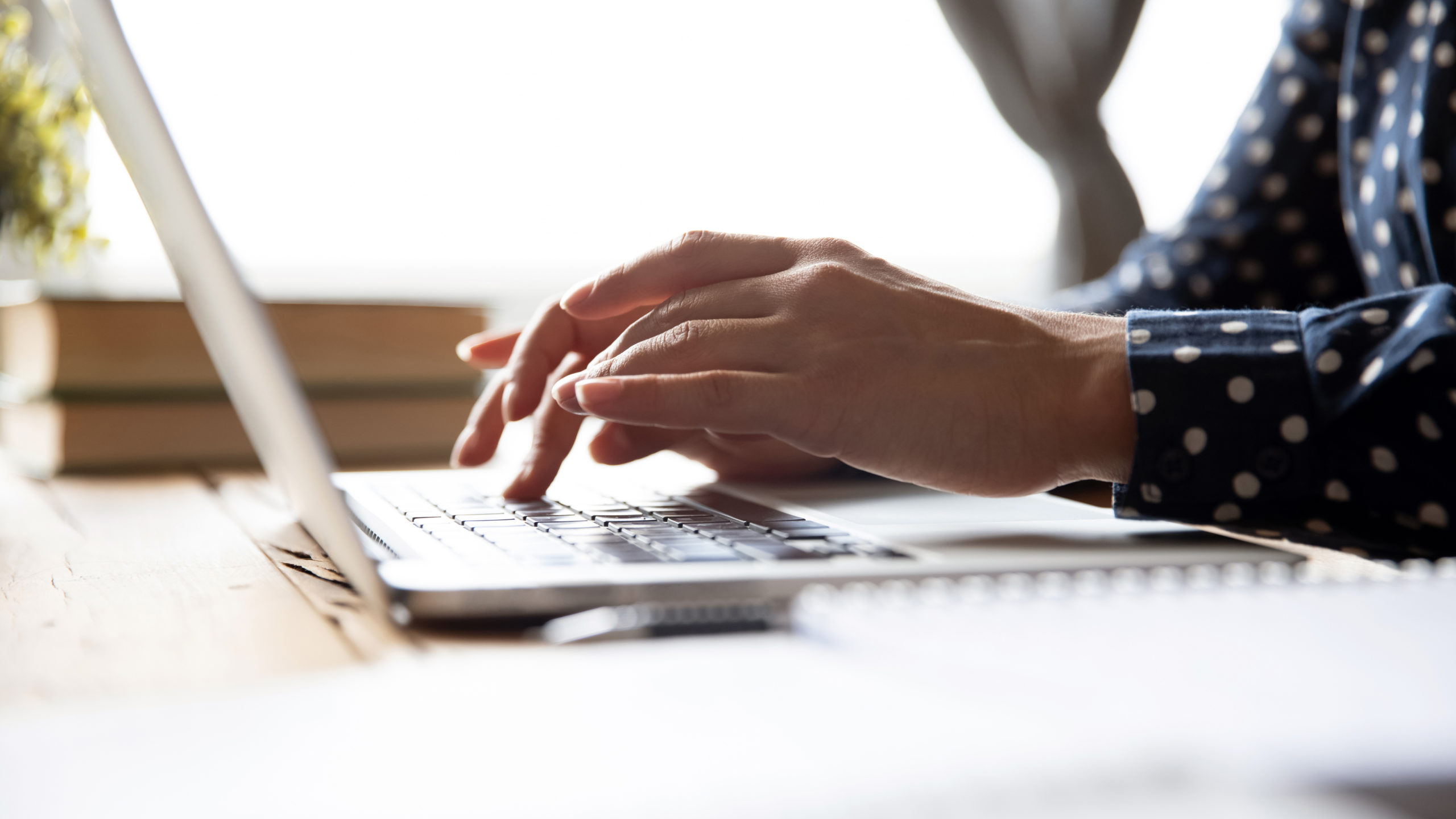 Researcher working remotely on a laptop conducting online behavioral research during the COVID-19 pandemic