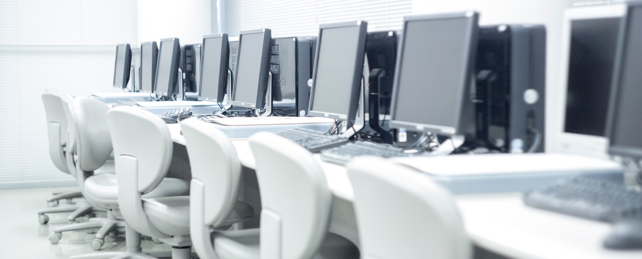 Row of computers in a computer lab.