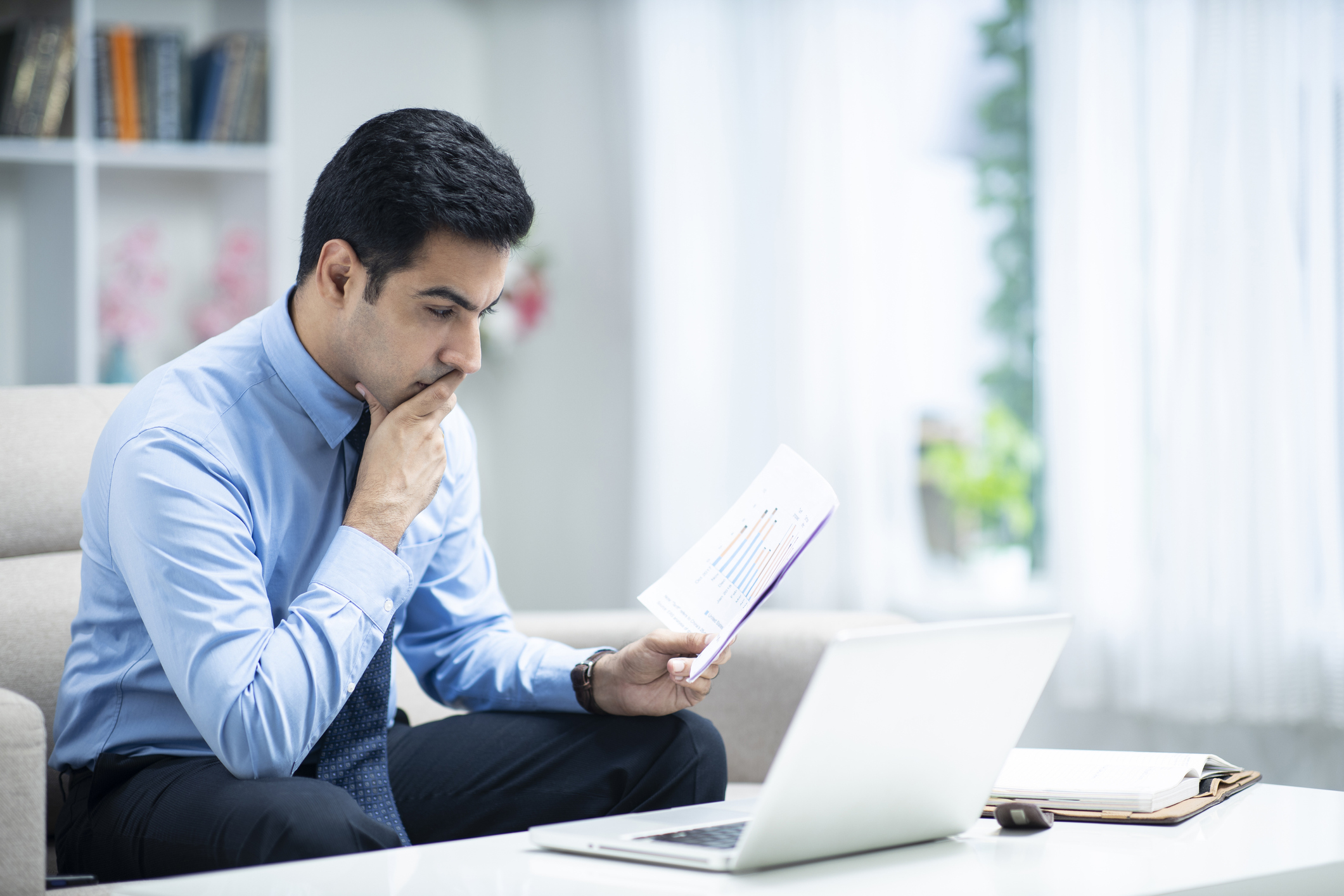 Business man working at home - stock photo